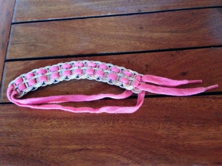 Soda tab bracelet made from soda tabs and pink shoelace.