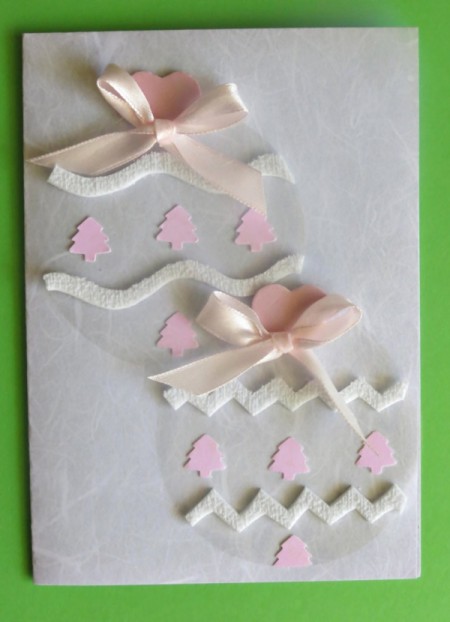 baubles glued to card with heart shaped tops and bows