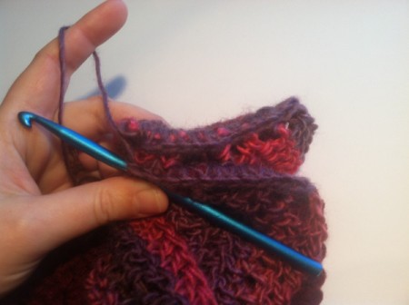 crocheting through both ends to form circle