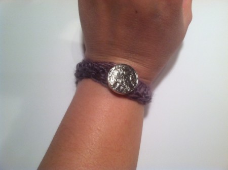 bracelet buttoned onto wrist
