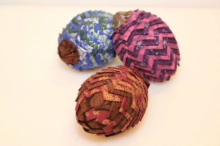 three fabric pinecone decorations