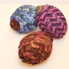 three fabric pinecone decorations