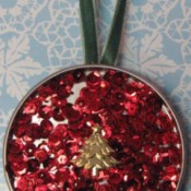 An ornament made from a juice can lid.