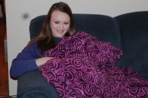 First Sewing Project: Fleece Blanket - girl on couch with blanket