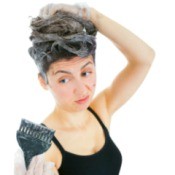 Woman Fixing Hair Color