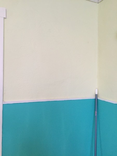 walls with off yellow on top and blue on bottom