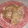 baked chicken on a red and white plate