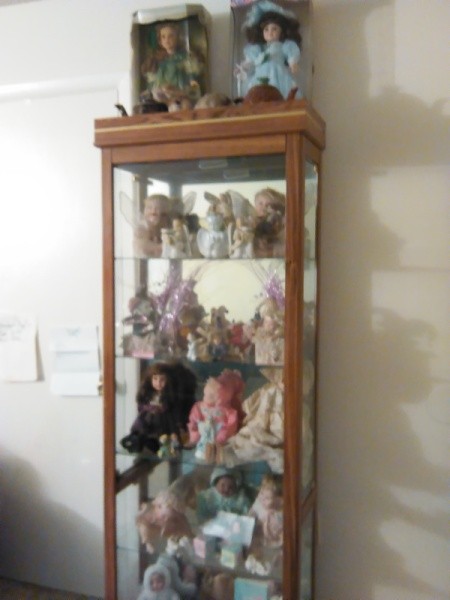 dolls in a display cabinet