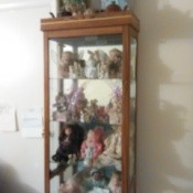dolls in a display cabinet