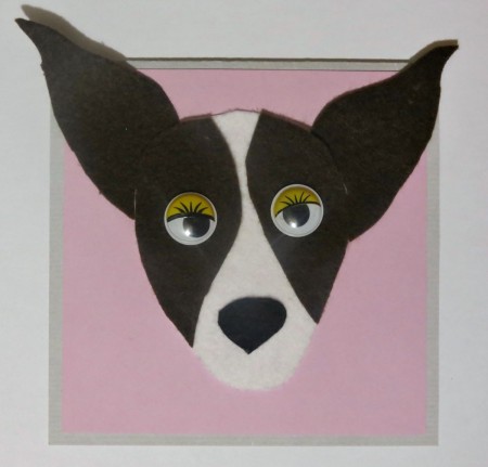 face glued to card before turning down ear tips