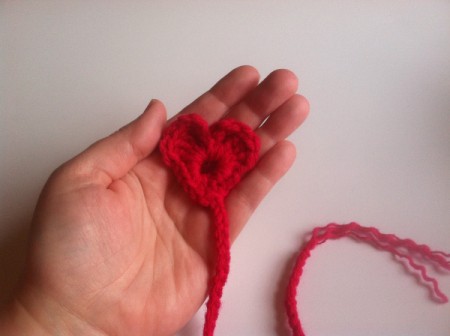 holding finished heart bookmark