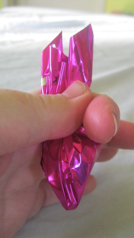 wrapping cellophane around Kisses