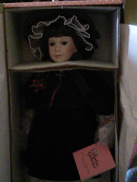 doll in box, very dark photo