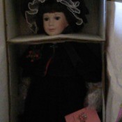 doll in box, very dark photo