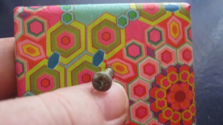 putting screw through hole