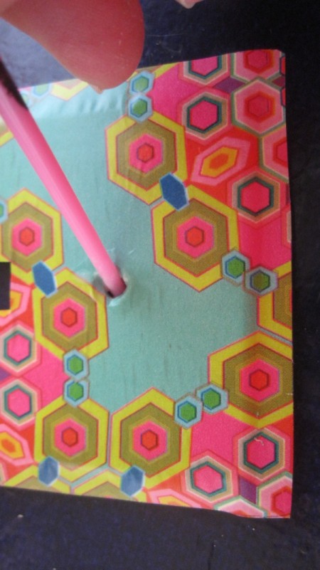 pressing paper into screw holes