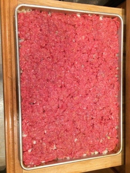 Easy Cookie Sheet Sliders - press beef into pan 2