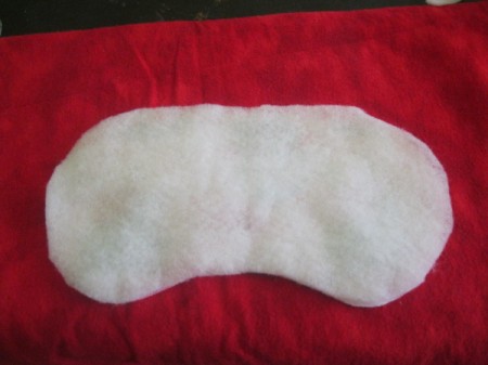 lay batting on top of fabric/elastic layers