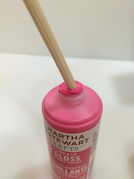 dipping skewers in paint