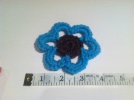 flower next to cloth tape measure