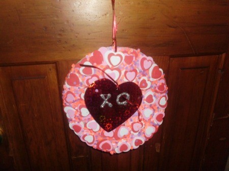 paper wreath with paper hearts glued on