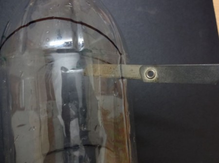 A hanging bottle planter