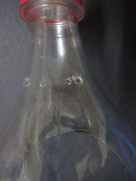 A hanging bottle planter