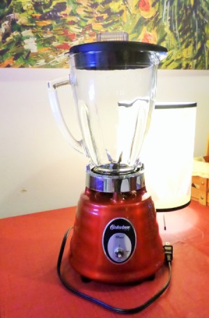 Red Blender on a kitchen counter.