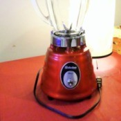 Red Blender on a kitchen counter.