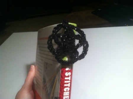 A crocheted medallion bookmark.