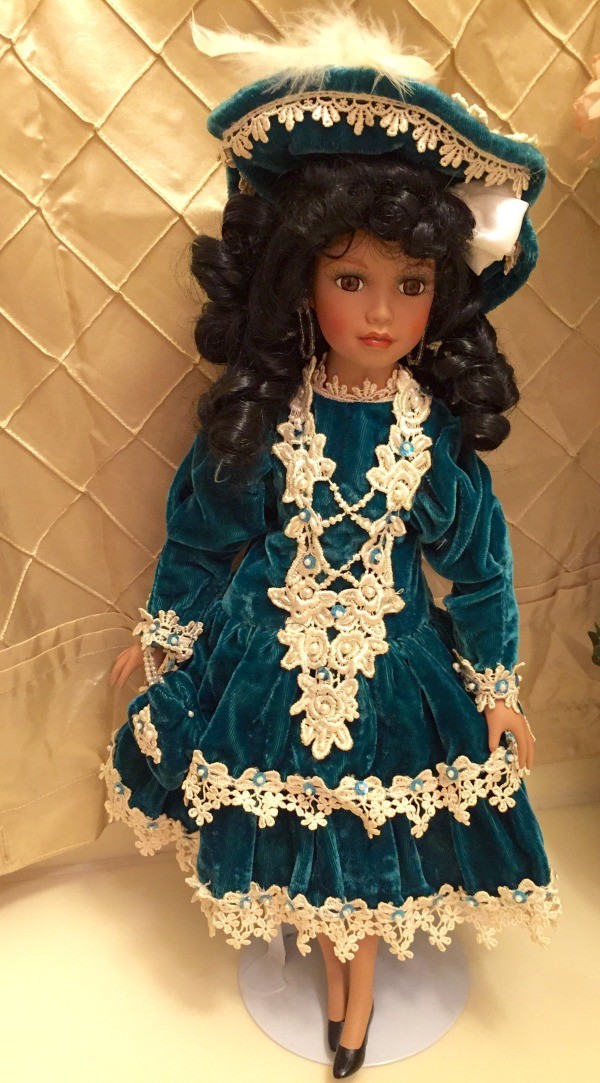 doll in green velvet dress with lace