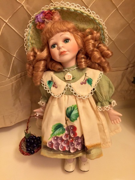 red headed doll in pinafore type dress