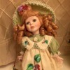 red headed doll in pinafore type dress