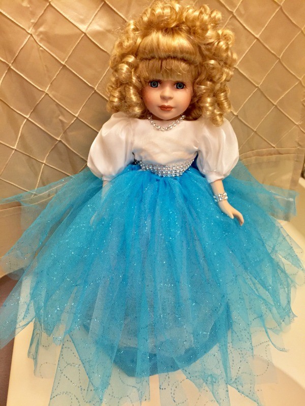 white dress bodice with peacock blue shirts