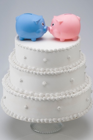 Piggy banks on top of wedding cake