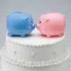 Piggy banks on top of wedding cake
