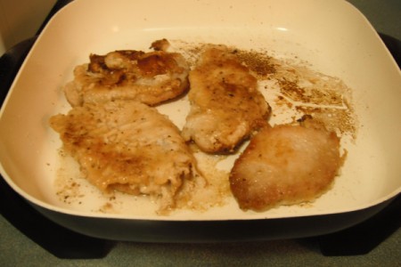 A pan of smothered pork chops.