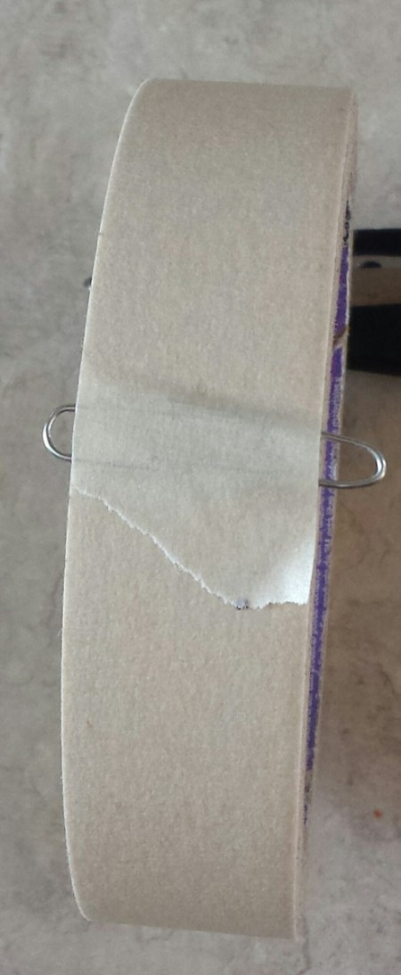 Paper clip holding tape end.