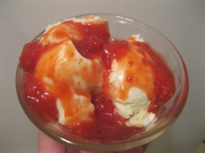 Homemade strawberry sauce served on ice cream.