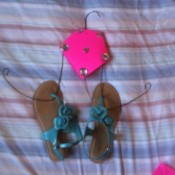 A finished recycled hanger flip flop holder.