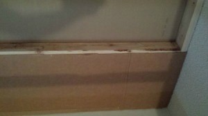 cardboard box nailed to studs