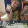 little girl with a ball of the dough