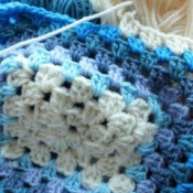 crochet granny square in blues and white