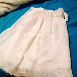 A christening gown made from an old wedding dress.