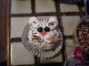 A cupcake decorated like a bunny.