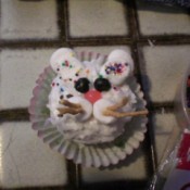 A cupcake decorated like a bunny.