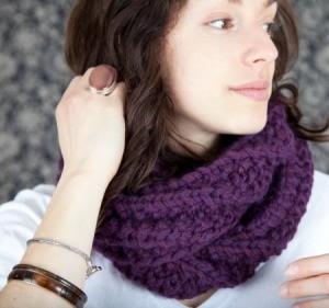 young woman wearing a purple scarf/cowl