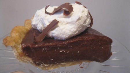 A piece of chocolate cream pie.