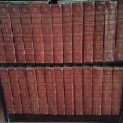volumes on bookshelf