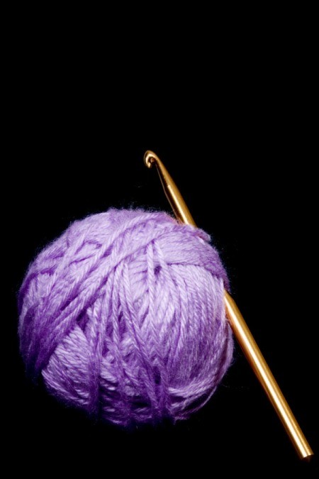 A ball of yarn and a crochet hook.